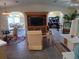 Open-concept living room with neutral tones, archways, and comfortable seating for relaxing at 805 S Waterway, Venice, FL 34285