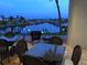 Inviting patio area overlooking the water, perfect for outdoor dining and enjoying scenic marina views at 805 S Waterway, Venice, FL 34285