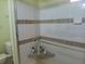 Shower features tiled walls and built-in shelving for toiletries at 805 S Waterway, Venice, FL 34285