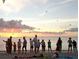 Beautiful sunset at the beach with birds and silhouettes of people on the shore at 915 Tartan Dr # 29, Venice, FL 34293