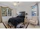 Bright bedroom features a large window, ceiling fan, and elegant decor with a decorative rug at 915 Tartan Dr # 29, Venice, FL 34293