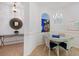 Charming dining area featuring decorative lighting, an arched window, and a cozy space perfect for Gathering meals at 915 Tartan Dr # 29, Venice, FL 34293