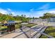 Community grill area with new grill ready for summer barbecues at 915 Tartan Dr # 29, Venice, FL 34293