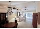 Spacious living room with high ceilings, neutral tones, and sliding glass doors at 915 Tartan Dr # 29, Venice, FL 34293