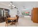 Inviting living space showcasing neutral tones, dining area, and outdoor access at 915 Tartan Dr # 29, Venice, FL 34293