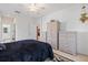 Bright bedroom featuring a dark bed and light wicker furniture at 915 Tartan Dr # 29, Venice, FL 34293