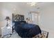 Bedroom featuring a floral headboard, ceiling fan, and lamps at 915 Tartan Dr # 29, Venice, FL 34293