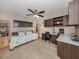 Bedroom with desk area, shelves, and a ceiling fan at 950 Tarpon Center Dr # 506, Venice, FL 34285