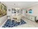 Cozy dining area adjacent to the kitchen, features stylish decor and ample natural light at 950 Tarpon Center Dr # 506, Venice, FL 34285