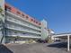 A beautiful building with exterior balconies, multiple stories and covered parking at 950 Tarpon Center Dr # 506, Venice, FL 34285