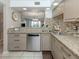 Kitchen with granite countertops, stainless steel appliances, and a view to the living space at 950 Tarpon Center Dr # 506, Venice, FL 34285