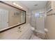 Bathroom featuring a marble countertop, a vanity and a glass enclosed shower in a neutrally painted space at 9542 Spring Cir, Port Charlotte, FL 33981
