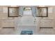 Bright bathroom featuring double sinks, a large tub, and natural lighting, creating a serene and functional space at 9542 Spring Cir, Port Charlotte, FL 33981