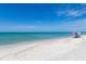 Beautiful white sand beach with calm turquoise waters, perfect for relaxation and leisure activities at 9542 Spring Cir, Port Charlotte, FL 33981