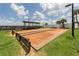 Outdoor bocce ball court area with shelter and benches, creating a space for recreation and community engagement at 9542 Spring Cir, Port Charlotte, FL 33981