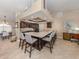 Spacious kitchen featuring a large island with seating and dark cabinetry, perfect for entertaining guests at 9542 Spring Cir, Port Charlotte, FL 33981