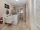 Laundry room features a large basin sink, washer and dryer, and ample storage space in a bright and airy space at 9542 Spring Cir, Port Charlotte, FL 33981