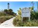 Historic Gasparilla Island Lighthouse sign with a walking trail, inviting exploration and discovery at 9542 Spring Cir, Port Charlotte, FL 33981