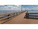 Long wooden pier extending over the water, offering a picturesque view and a relaxing place for a stroll at 9542 Spring Cir, Port Charlotte, FL 33981