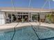 Enjoy outdoor living at its finest with this inviting pool and patio area, perfect for relaxation and entertaining at 9542 Spring Cir, Port Charlotte, FL 33981