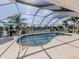 Lovely screened in pool, perfect for enjoying the Florida lifestyle while relaxing and entertaining with waterfront view at 9542 Spring Cir, Port Charlotte, FL 33981