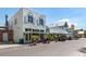 Charming street view with quaint shops and golf carts, offering a relaxed and inviting atmosphere at 9542 Spring Cir, Port Charlotte, FL 33981