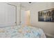 Bedroom features a queen bed, wood floors, with a double door closet at 9800 Bright Water Dr, Englewood, FL 34223