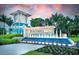 Community entrance with beautiful water feature, landscaping, and signature 'Beachwalk' signage at 9800 Bright Water Dr, Englewood, FL 34223