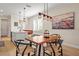 Bright dining area with views of the kitchen and the outdoors. Offers smooth transition and seating at 9800 Bright Water Dr, Englewood, FL 34223