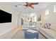 Another view of the living room shows the open layout and easy access to the kitchen and dining areas at 9800 Bright Water Dr, Englewood, FL 34223