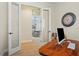Office with glass doors that open to the dining room. Modern desk and lots of light at 9800 Bright Water Dr, Englewood, FL 34223
