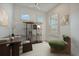 Bright and airy office with modern decor and an eye-catching accent chair at 10399 Abaco Falls Dr, Englewood, FL 34223