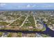 Amazing aerial perspective highlighting the many canals, homes, and community layout of the area at 10139 Kansas City St, Port Charlotte, FL 33981