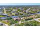 Panoramic aerial view showcasing the neighborhood with waterways, boat docks and stunning landscaping at 10139 Kansas City St, Port Charlotte, FL 33981