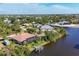 Expansive aerial view of waterfront homes, canals and verdant foliage creating a tranquil neighborhood at 10139 Kansas City St, Port Charlotte, FL 33981