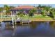 Waterfront backyard features a private dock and screened in lanai perfect for relaxation at 10139 Kansas City St, Port Charlotte, FL 33981