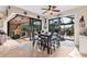 Dining area offering direct access to a screened-in patio, suitable for outdoor dining at 10139 Kansas City St, Port Charlotte, FL 33981