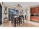 Dining area with view to the outside patio, tile floors, and decorative wall art at 10139 Kansas City St, Port Charlotte, FL 33981