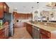 Spacious kitchen featuring stainless steel appliances, granite countertops and beautiful wood cabinetry at 10139 Kansas City St, Port Charlotte, FL 33981