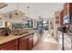 Kitchen featuring stainless steel appliances, granite countertops, tile floors and direct access to the outside patio at 10139 Kansas City St, Port Charlotte, FL 33981