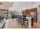Bright kitchen with a breakfast bar, granite countertops, and access to an outdoor dining area and screened-in patio at 10139 Kansas City St, Port Charlotte, FL 33981