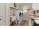 Efficient laundry room with granite counters, sink, and modern washer and dryer at 10139 Kansas City St, Port Charlotte, FL 33981