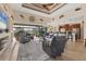 Open-concept living room flows into the kitchen, with a fireplace and access to the screened lanai at 10139 Kansas City St, Port Charlotte, FL 33981