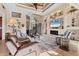 Cozy living room with a fireplace, tv, and comfortable seating, perfect for relaxing at 10139 Kansas City St, Port Charlotte, FL 33981