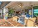 Charming outdoor patio featuring stylish wicker furniture and sliding glass doors, great for entertaining guests at 10139 Kansas City St, Port Charlotte, FL 33981