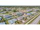 Residential area with well-kept homes, featuring fenced yards, pools, and manicured landscapes at 1048 Ulrey Ln, Englewood, FL 34223