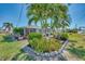 A delightful backyard featuring lush landscaping, a patio, and a tranquil setting at 1048 Ulrey Ln, Englewood, FL 34223