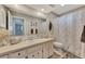 The bathroom includes a large mirror, a toilet, and a shower with curtain at 1048 Ulrey Ln, Englewood, FL 34223