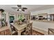 Inviting dining area next to the kitchen offers a view of the kitchen and outdoor living space at 1048 Ulrey Ln, Englewood, FL 34223