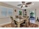 Inviting dining area is bathed in natural light with a view of the outdoor living space at 1048 Ulrey Ln, Englewood, FL 34223